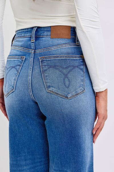 Side view of model wearing Judy Blue High-Waist Wide-Leg Jeans, offering a relaxed fit that transitions effortlessly from day to night.